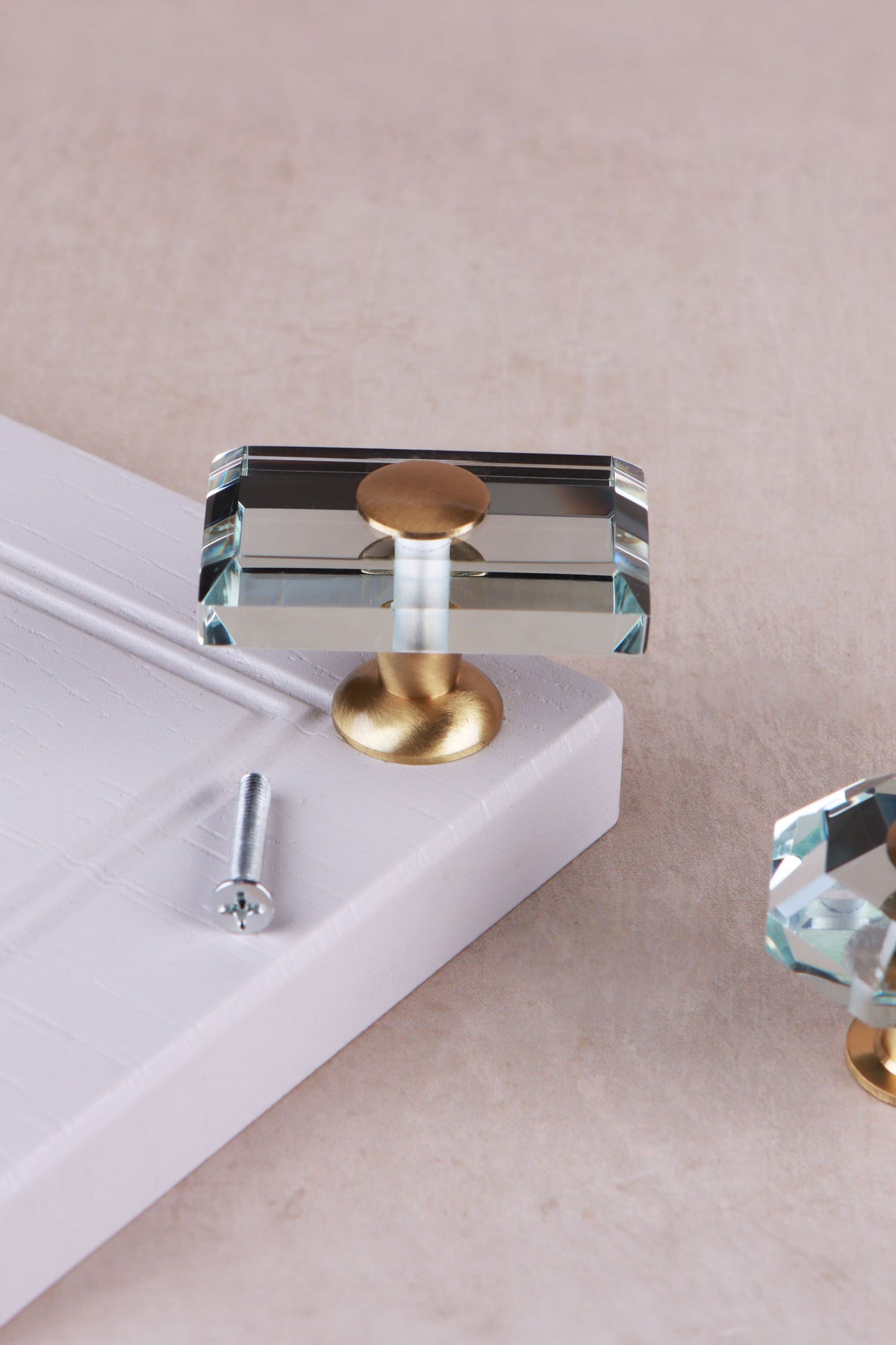 Rectangle clear crystal glass cabinet knob, 50 x 32mm, on a satin brass base