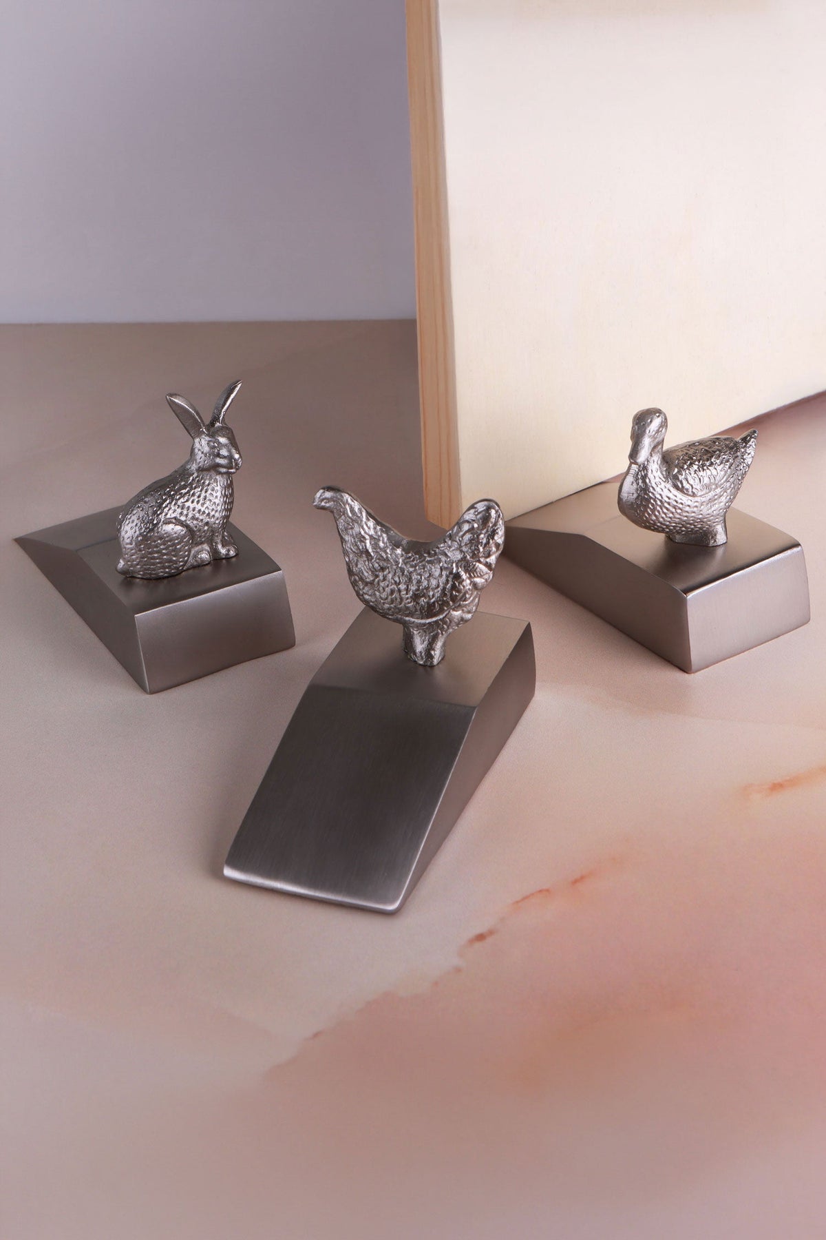 Homestead Collection duck, hen and rabbit door stoppers in chrome