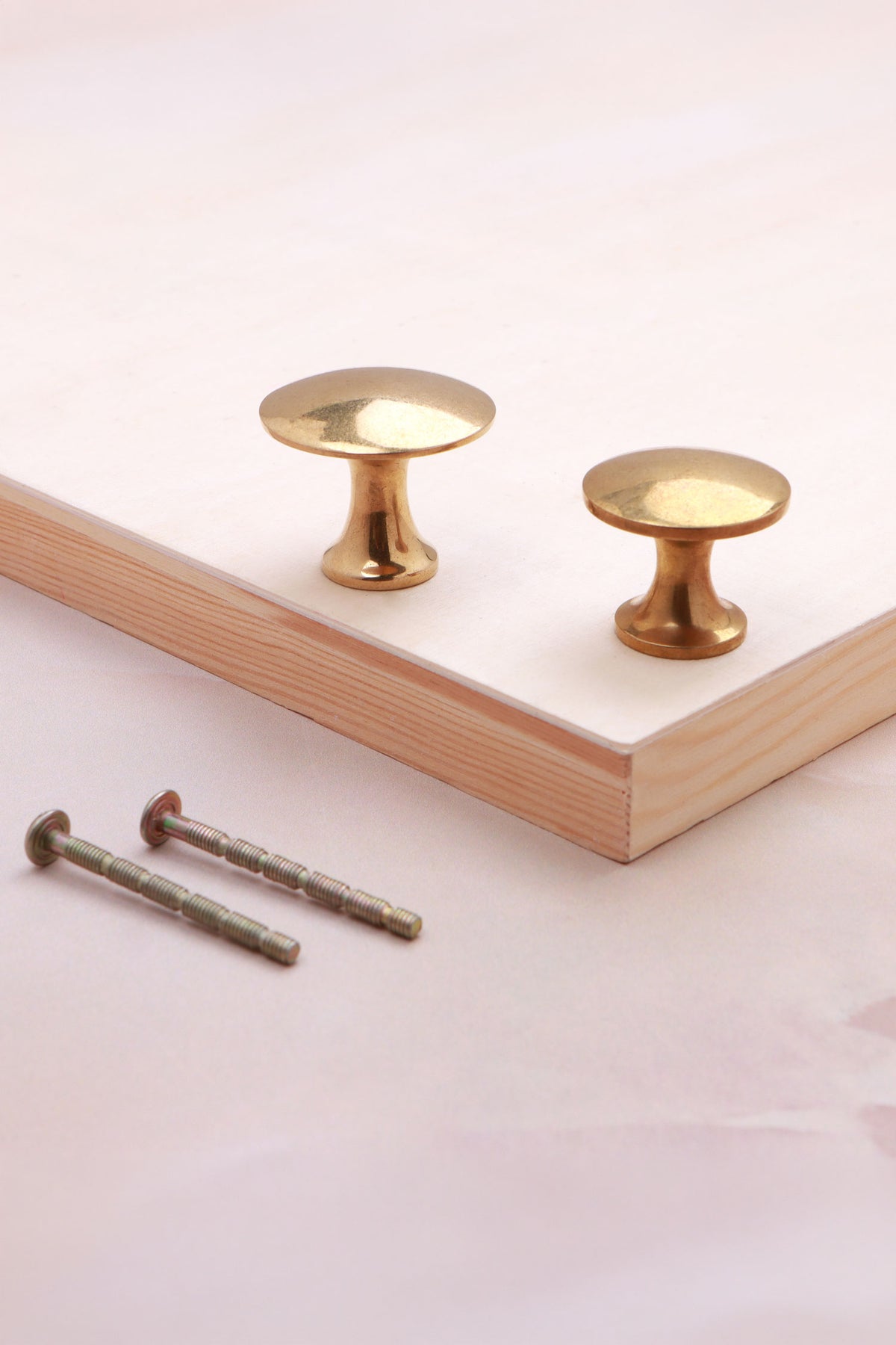 Flat top cabinet knob in aged brass