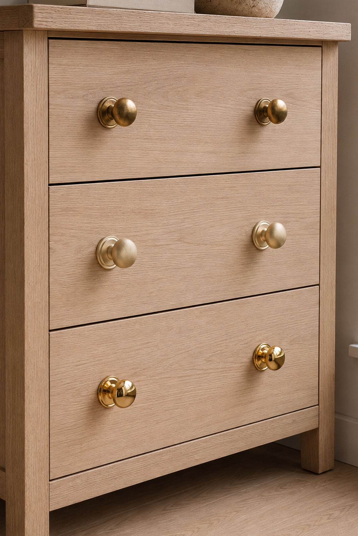 Bun cabinet knob in polished, aged and satin brass, second view