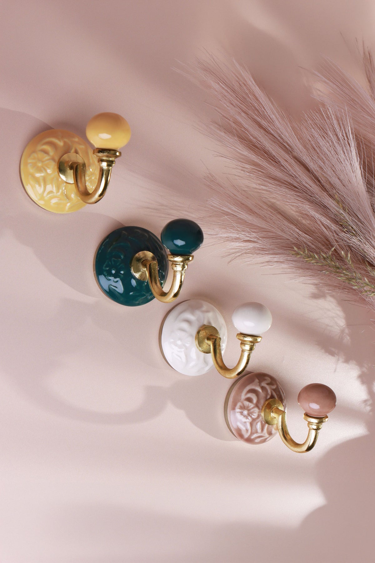 Floral ceramic wall hooks with brass hooks in cream, yellow, dark green and dusky pink