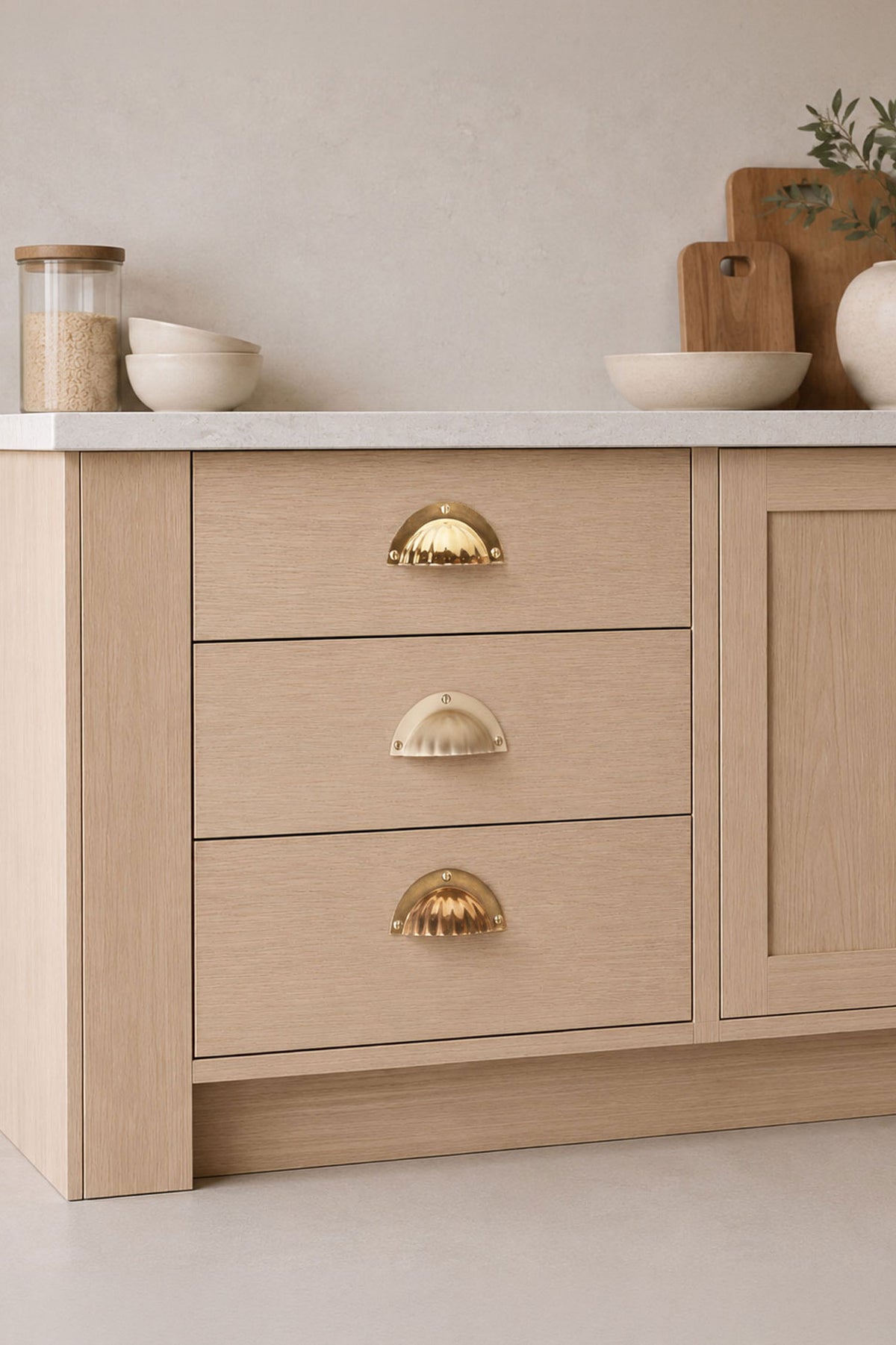 Fluted cup pull in polished, aged and satin brass