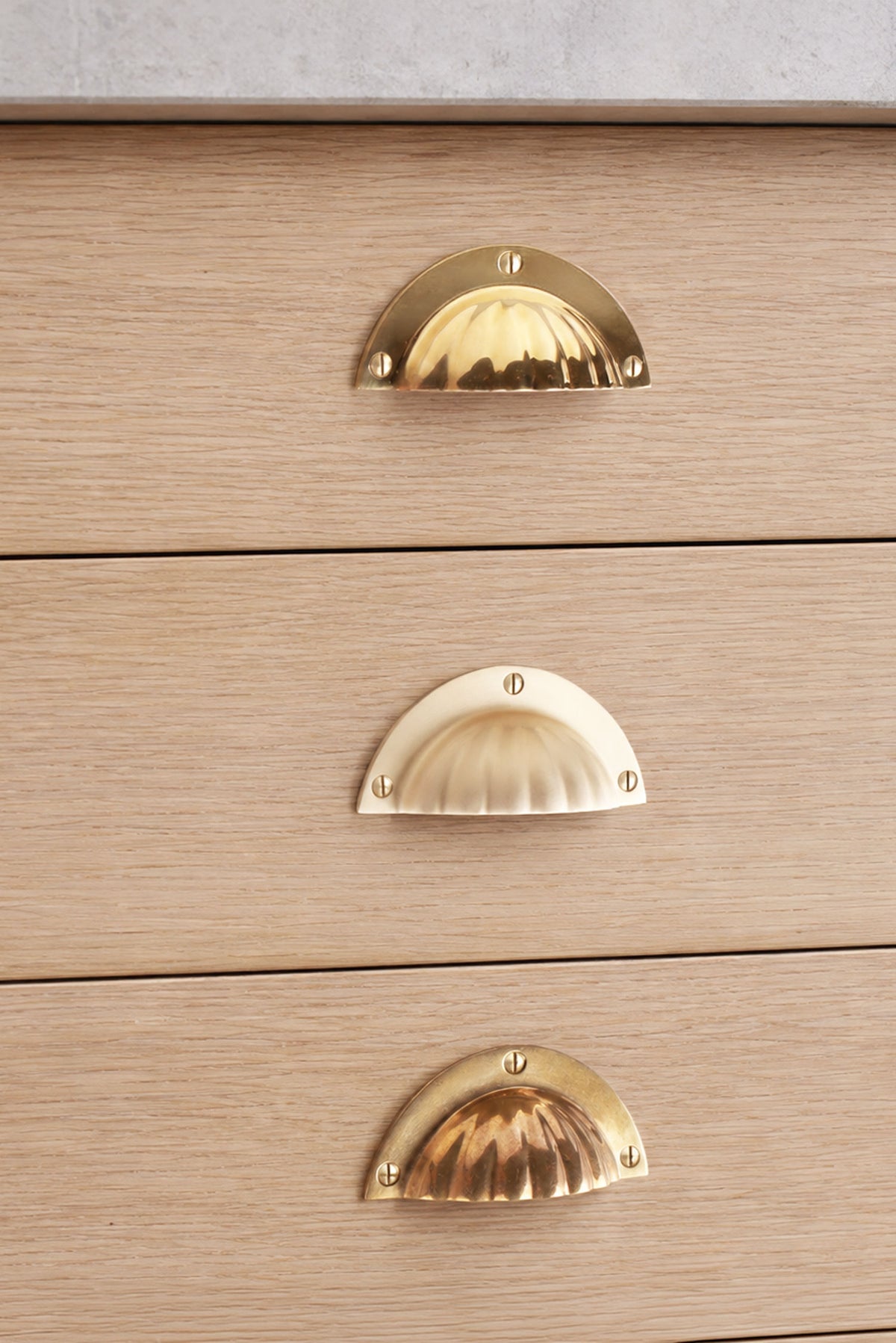 Fluted cup pull in polished, aged and satin brass, second view