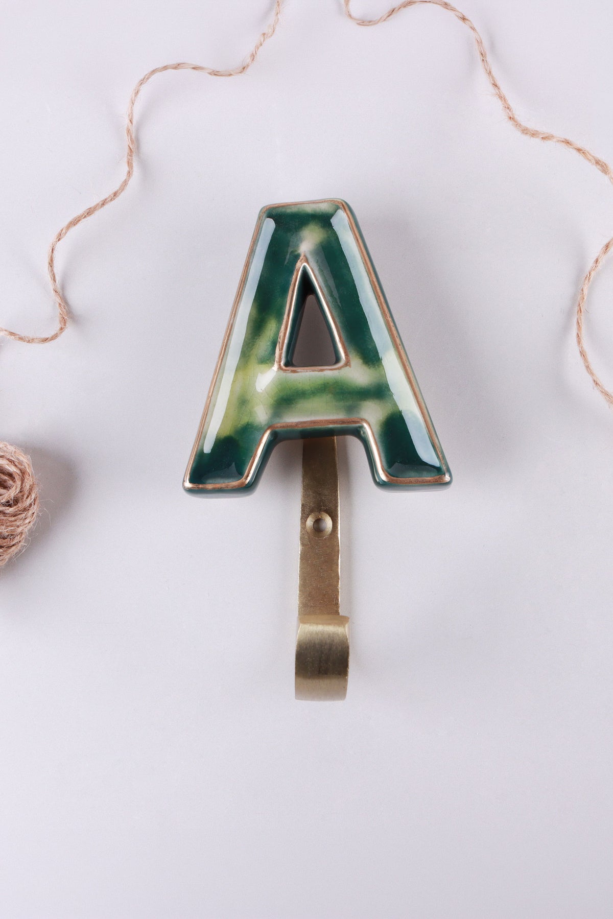 Green ceramic letter hook A with a gold rim