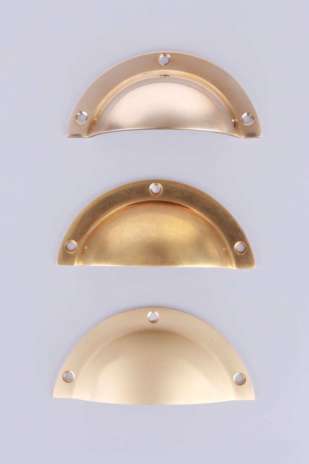 Stepped rim cup pull in polished, aged and satin brass, third view