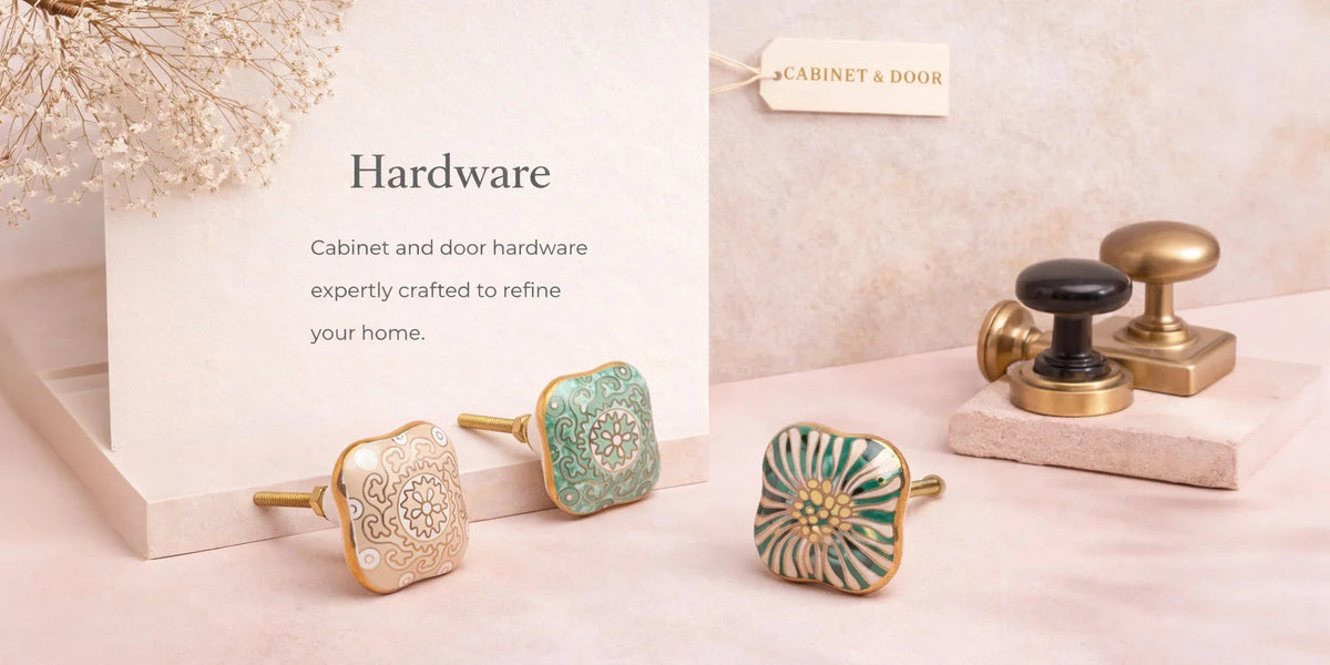 Hand-painted ceramic mortice door knobs and solid brass cabinet hardware photographed on a kitchen worktop in soft early-morning light — G Decor