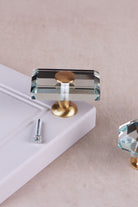 Rectangle clear crystal glass cabinet knob, 50 x 32mm, on a satin brass base