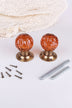 Pair of amber faceted glass mortice door knobs on antique brass roses, with the square spindles and fixing screws