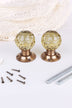 Pair of ivory faceted glass mortice door knobs on antique brass roses, with the square spindles and fixing screws