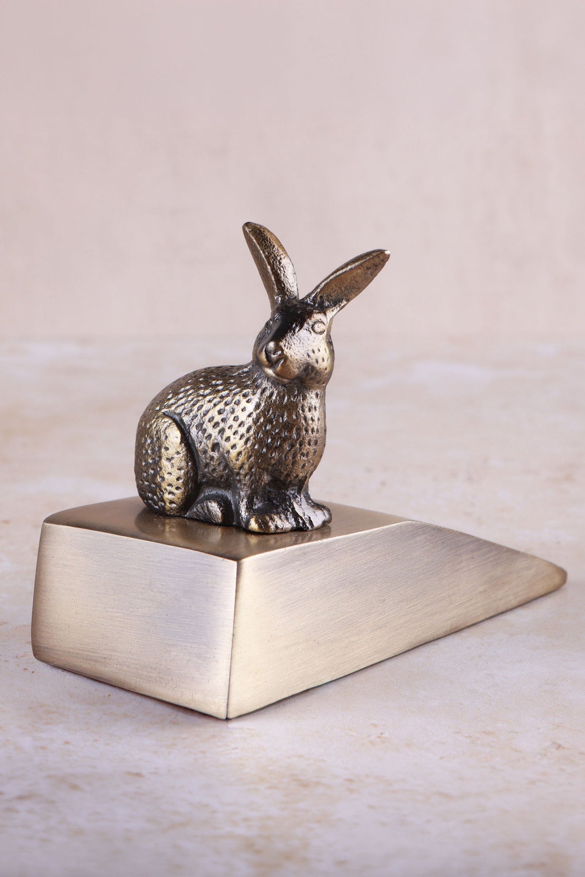 Rabbit door stopper in antique brass, side view
