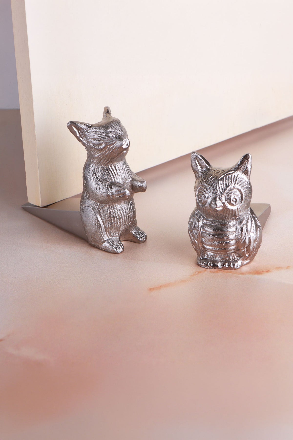 Woodland owl and squirrel door stoppers in chrome