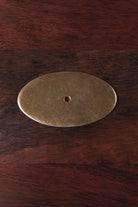 Oval aged brass backplate rosette, 70 by 40mm, with central fixing hole