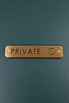 Satin Brass Engraved Door Sign for Restroom Toilets or Private — lifestyle view, G Decor