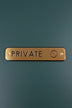 Satin Brass Engraved Door Sign for Restroom Toilets or Private — lifestyle view, G Decor