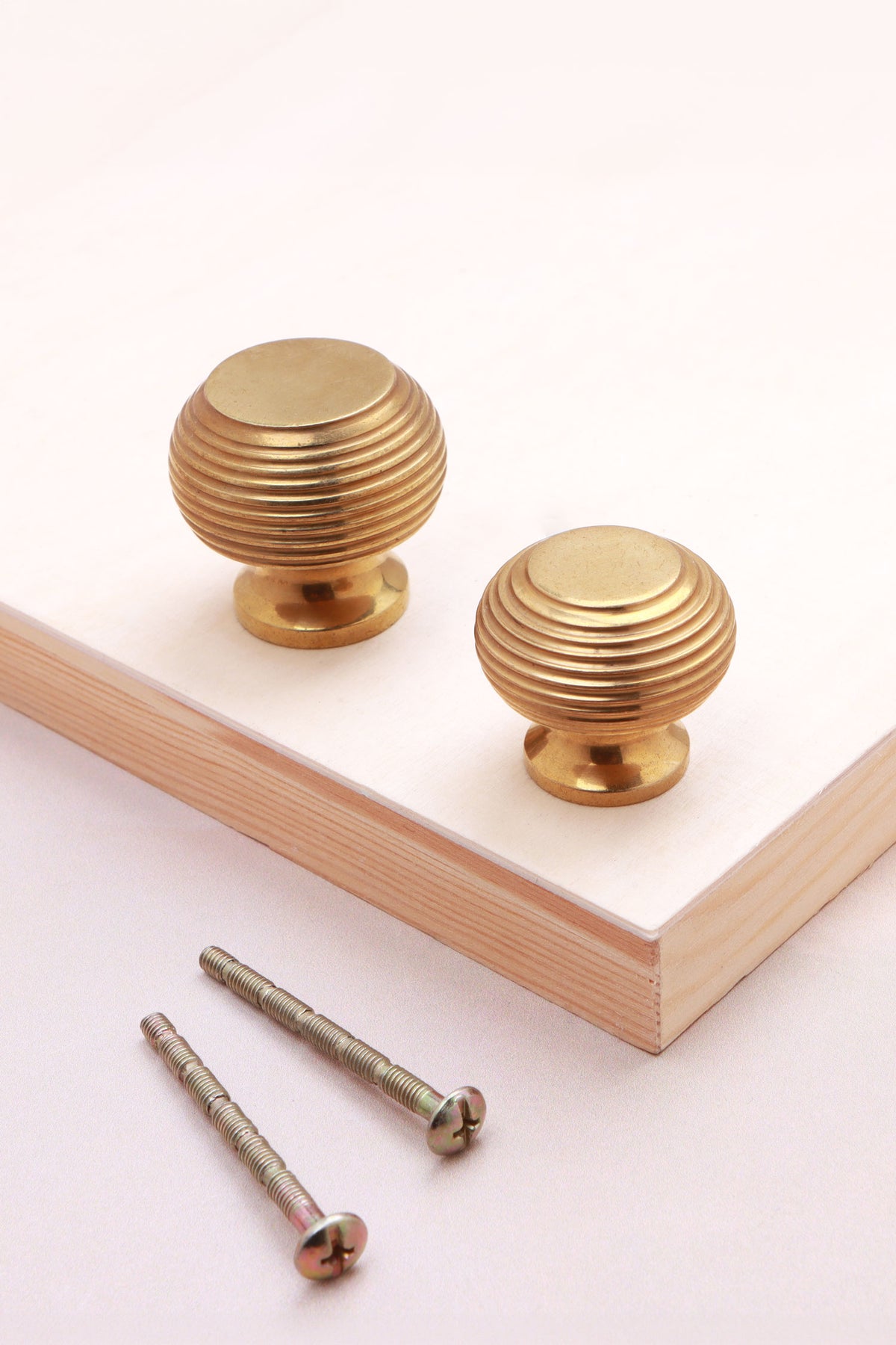 Aged brass beehive knobs, 32mm and 38mm, with fixing bolts
