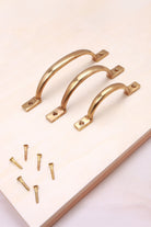 D handle in aged brass