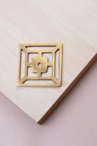 Aged brass fretwork backplate, 45 x 45mm, an open square fret: solid brass with a 4mm centre hole for the knob bolt