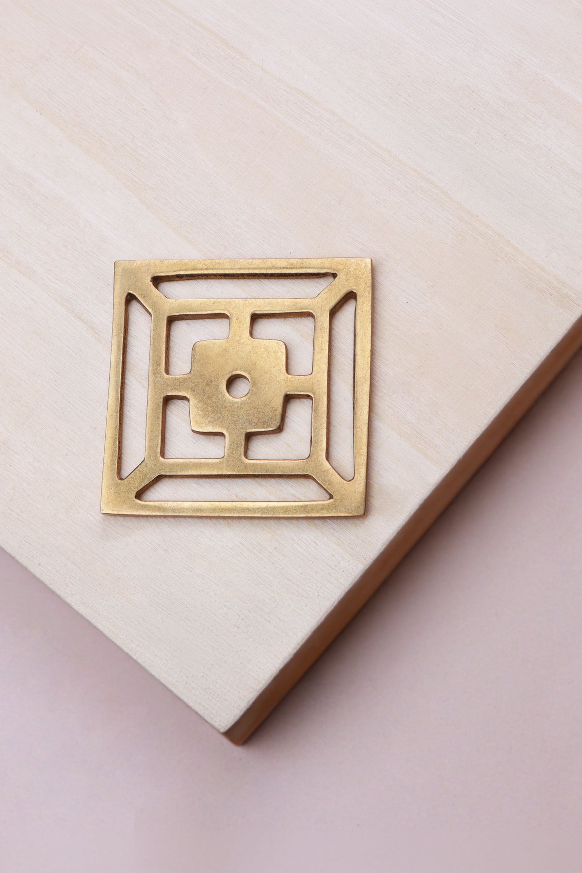 Aged brass fretwork backplate, 45 x 45mm, an open square fret: solid brass with a 4mm centre hole for the knob bolt