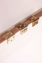 Backflap hinge in polished, aged and satin brass