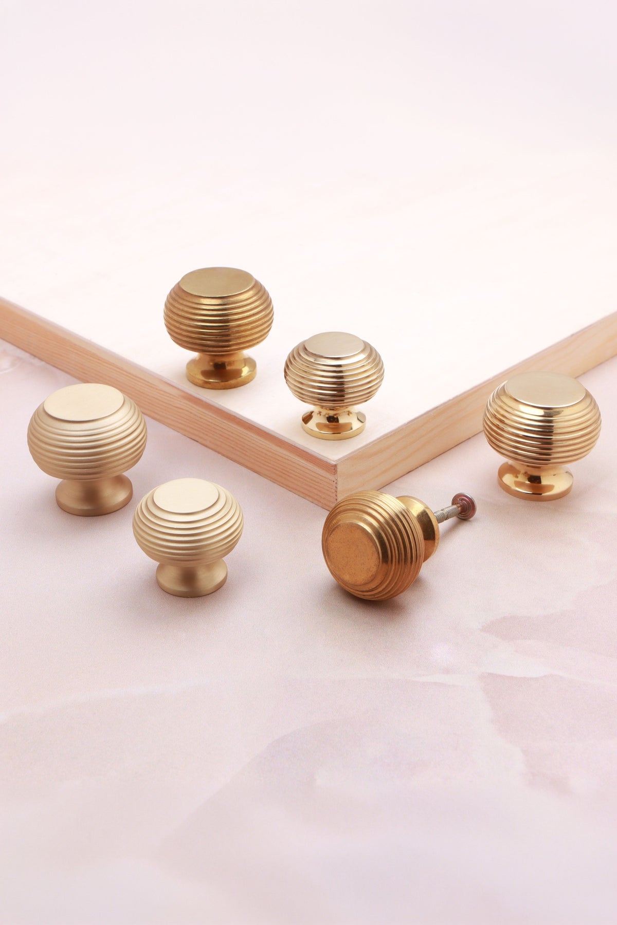Beehive cabinet knob in polished, aged and satin brass, third view