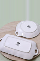 Underside of both plates showing the G Decor stamp on the white glazed base