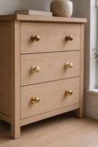 Bun cabinet knob in polished, aged and satin brass