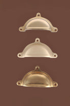 Classic cup pull in polished, aged and satin brass, third view