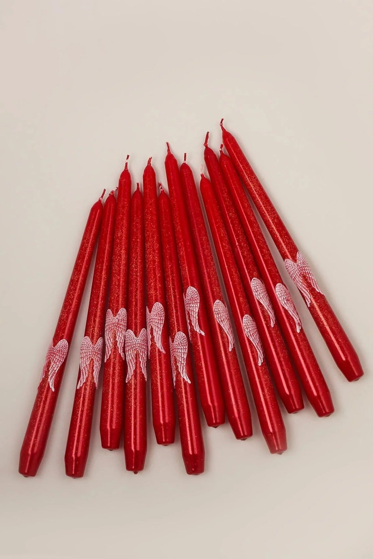 Featheré Wings Pair of Red Wax Taper Candles with Angel Wing Detail — lifestyle view, G Decor