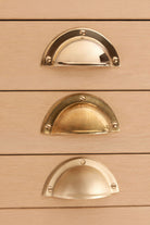 Half moon cup pull in polished, aged and satin brass