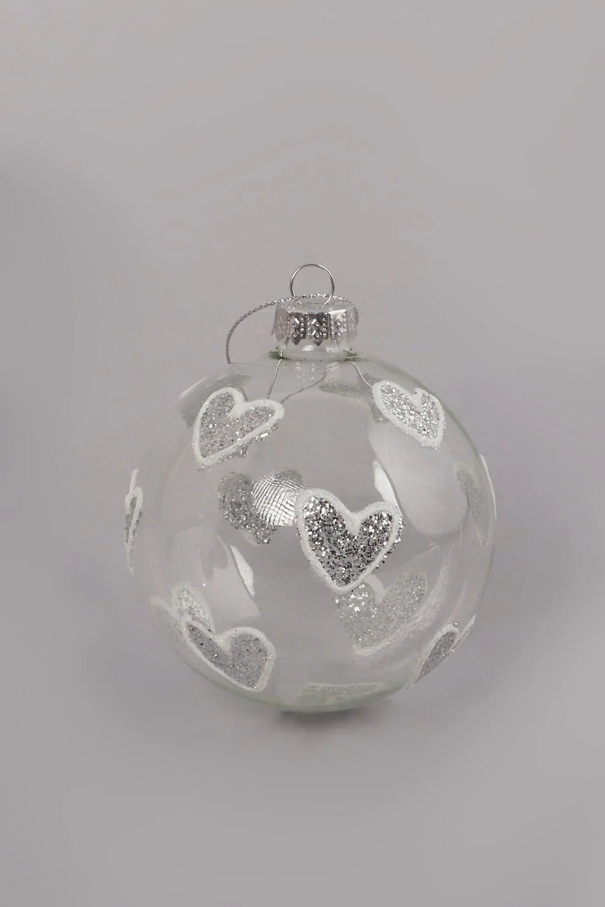 Hand-Blown Clear Glass Christmas Bauble with Silver Glitter Hearts — close-up view, G Decor