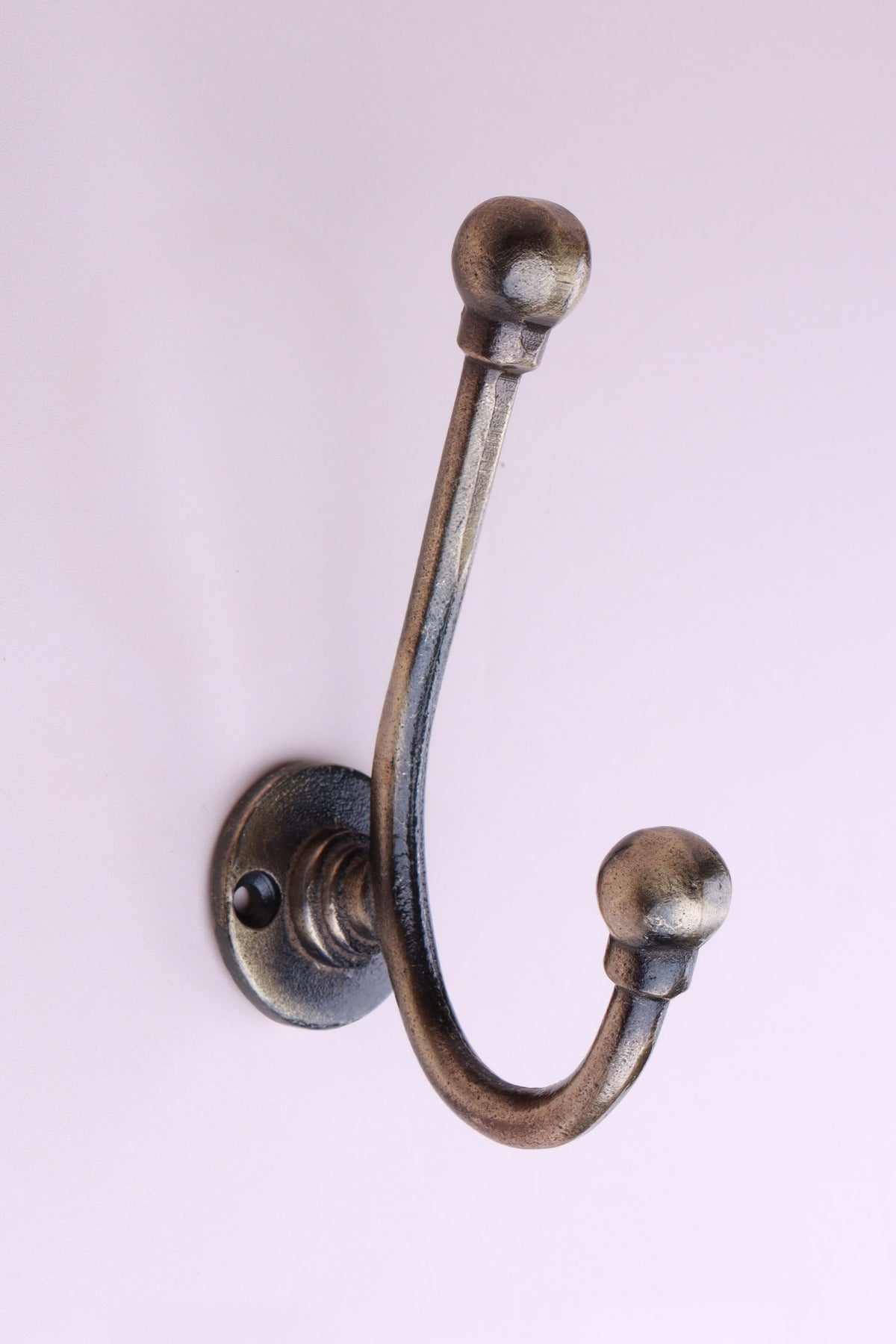 Long Ball Tip Hook: cast iron slim double hook with ball tips, on a round collared back plate, antique brass finish