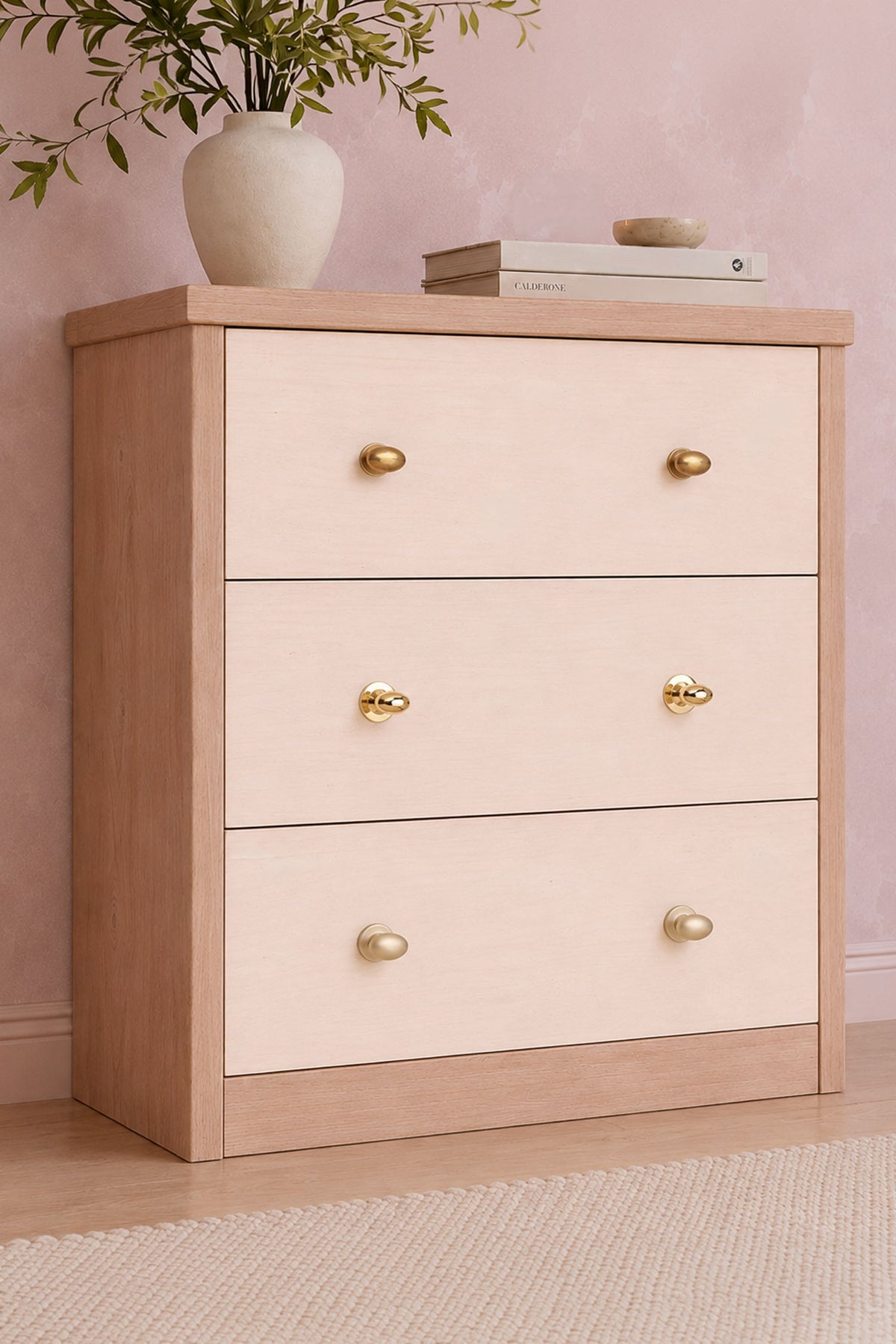Oval cabinet knob on rose in polished, aged and satin brass