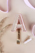 Pink ceramic letter hook A with a gold rim