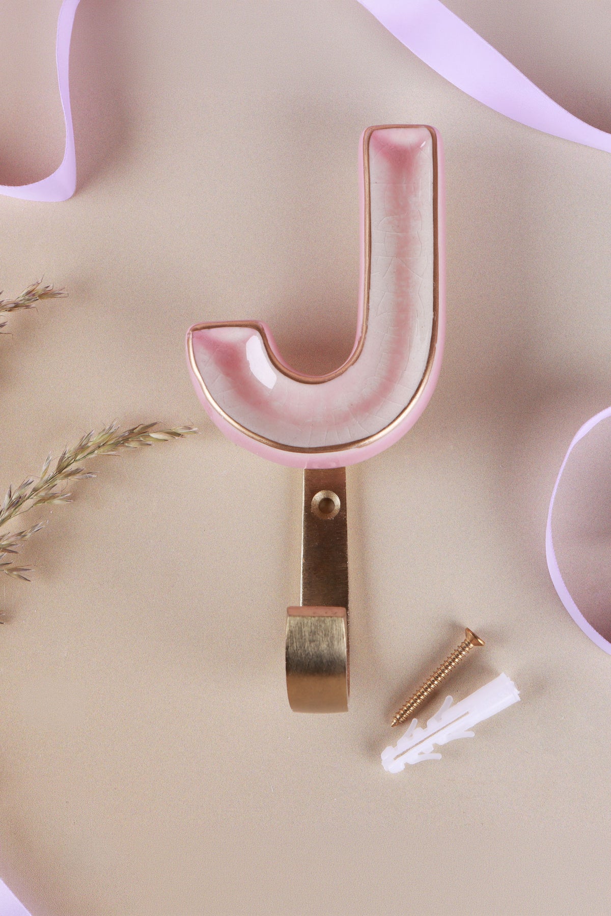 Pink ceramic letter hook J with a gold rim