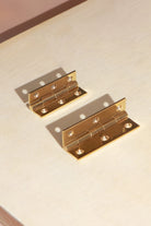 Butt hinge in polished brass, third view
