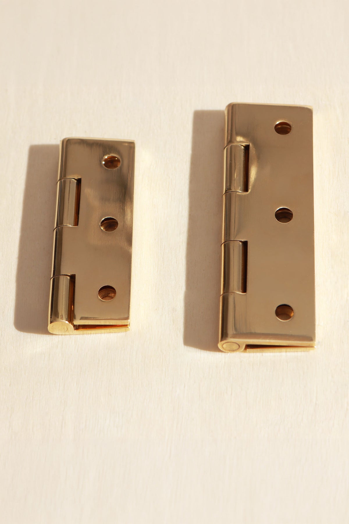 Butt hinge in polished brass, fourth view