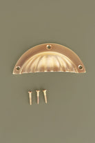 Fluted cup pull in polished brass