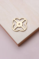 Polished brass pierced backplate, 38 x 38mm, an open quatrefoil: solid brass with a 4mm centre hole for the knob bolt