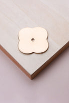 Polished brass quatrefoil backplate, 42 x 42mm: solid brass with a 4mm centre hole for the knob bolt