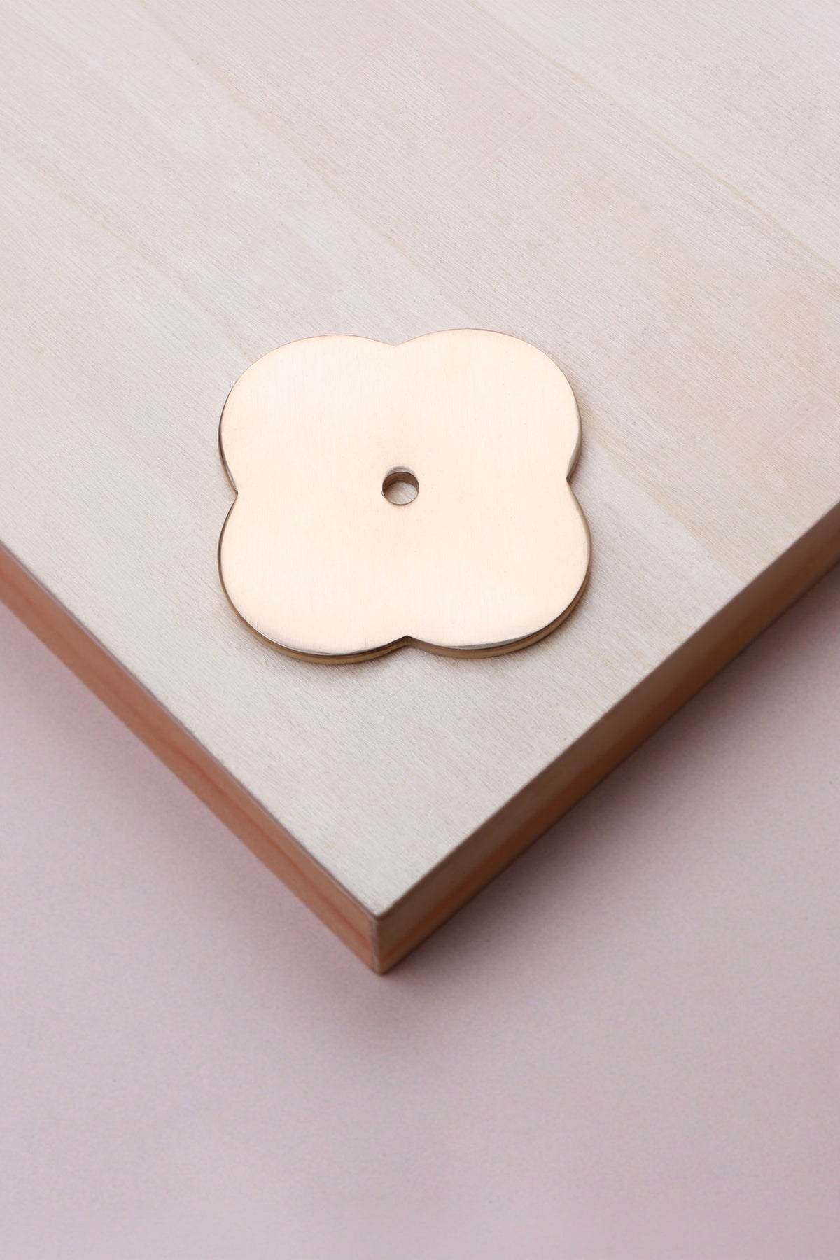 Polished brass quatrefoil backplate, 42 x 42mm: solid brass with a 4mm centre hole for the knob bolt