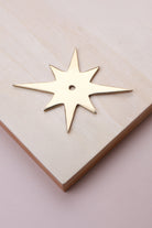 Polished brass star backplate, 87 x 68mm: solid brass with a 4mm centre hole for the knob bolt