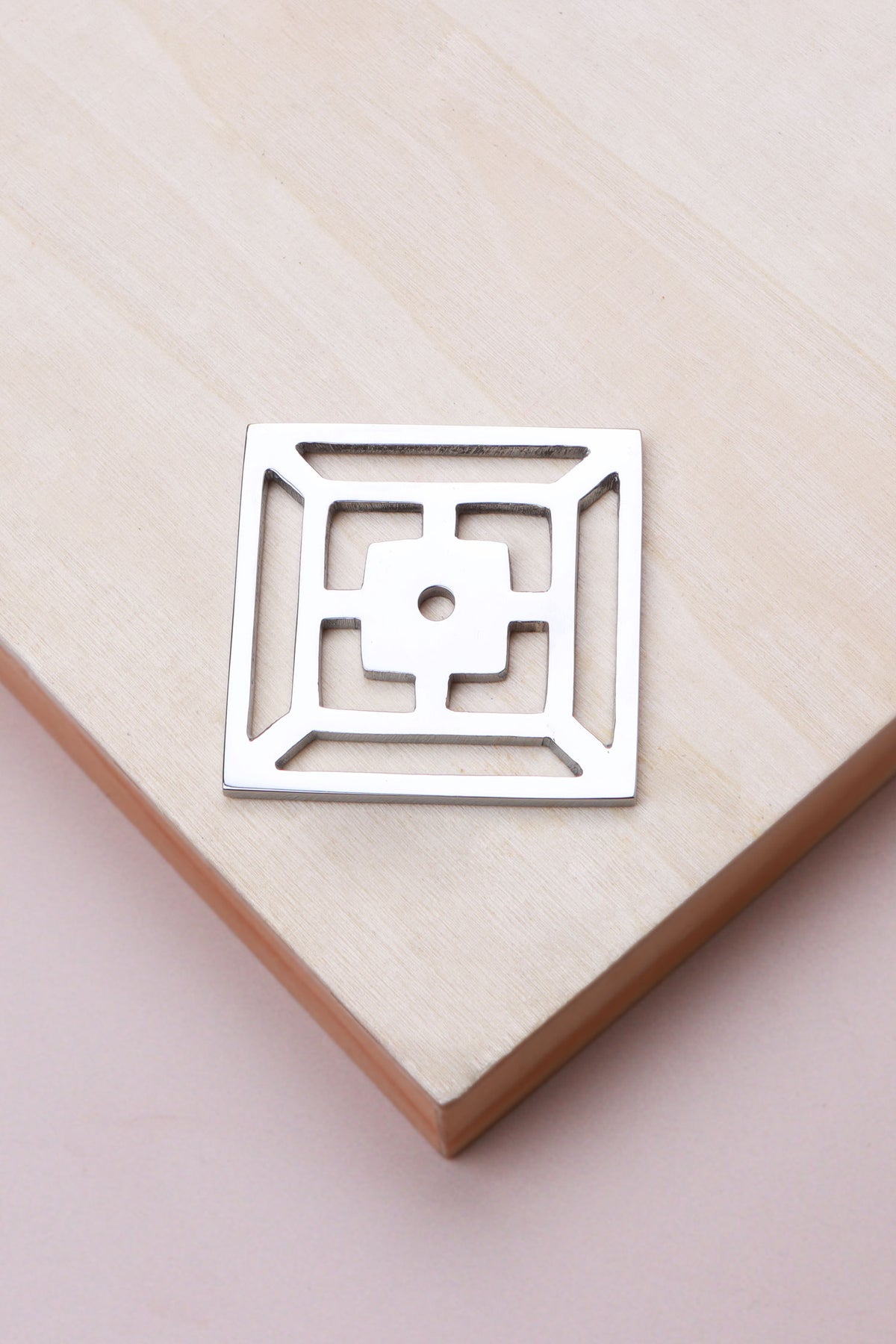 Polished chrome fretwork backplate, 45 x 45mm, an open square fret: chrome-plated solid brass with a 4mm centre hole for the knob bolt