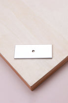 Polished chrome rectangle backplate, 60 x 25mm: chrome-plated solid brass with a 4mm centre hole for the knob bolt