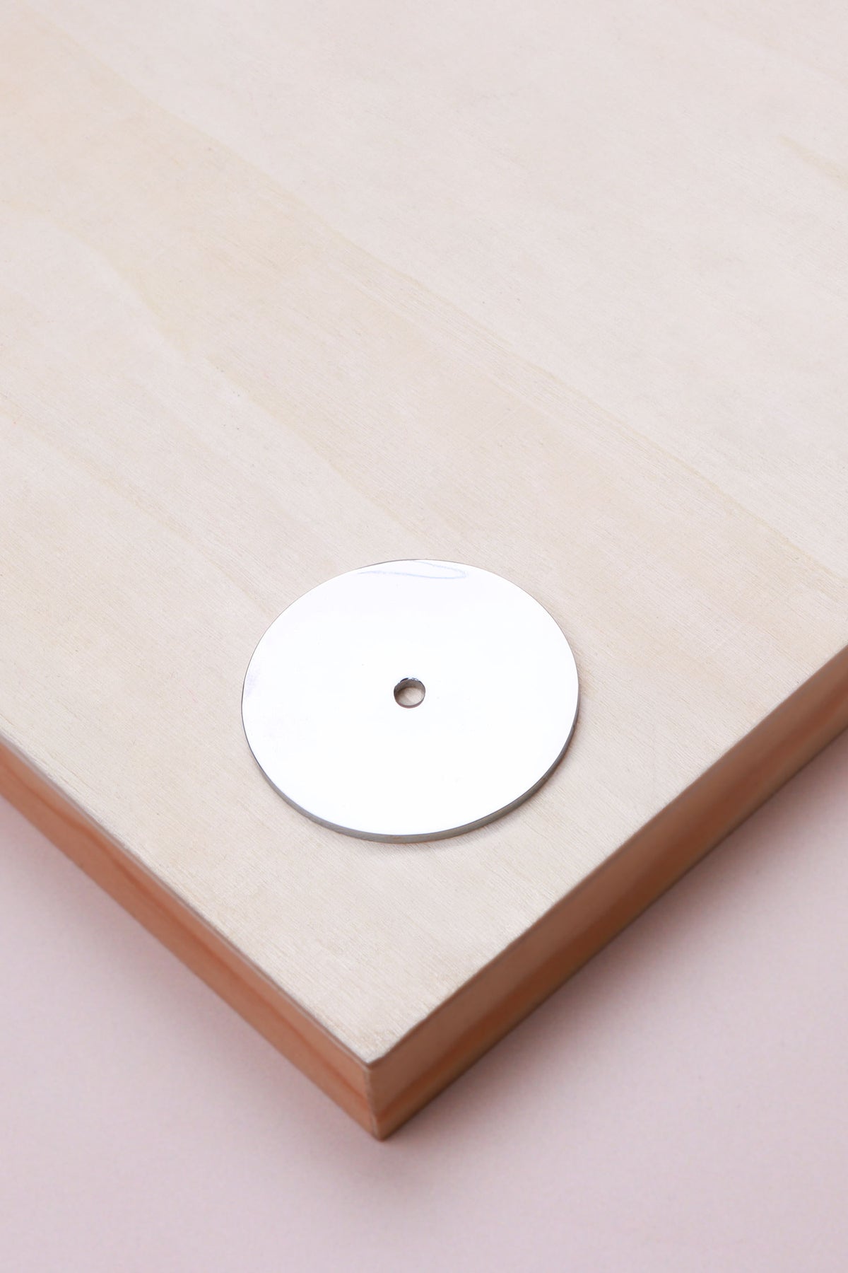 Polished chrome round backplate, 45mm across: chrome-plated solid brass with a 4mm centre hole for the knob bolt