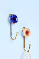 Rhodes Family Ceramic Wall Hook in Crackle Glaze with Brass — G Decor