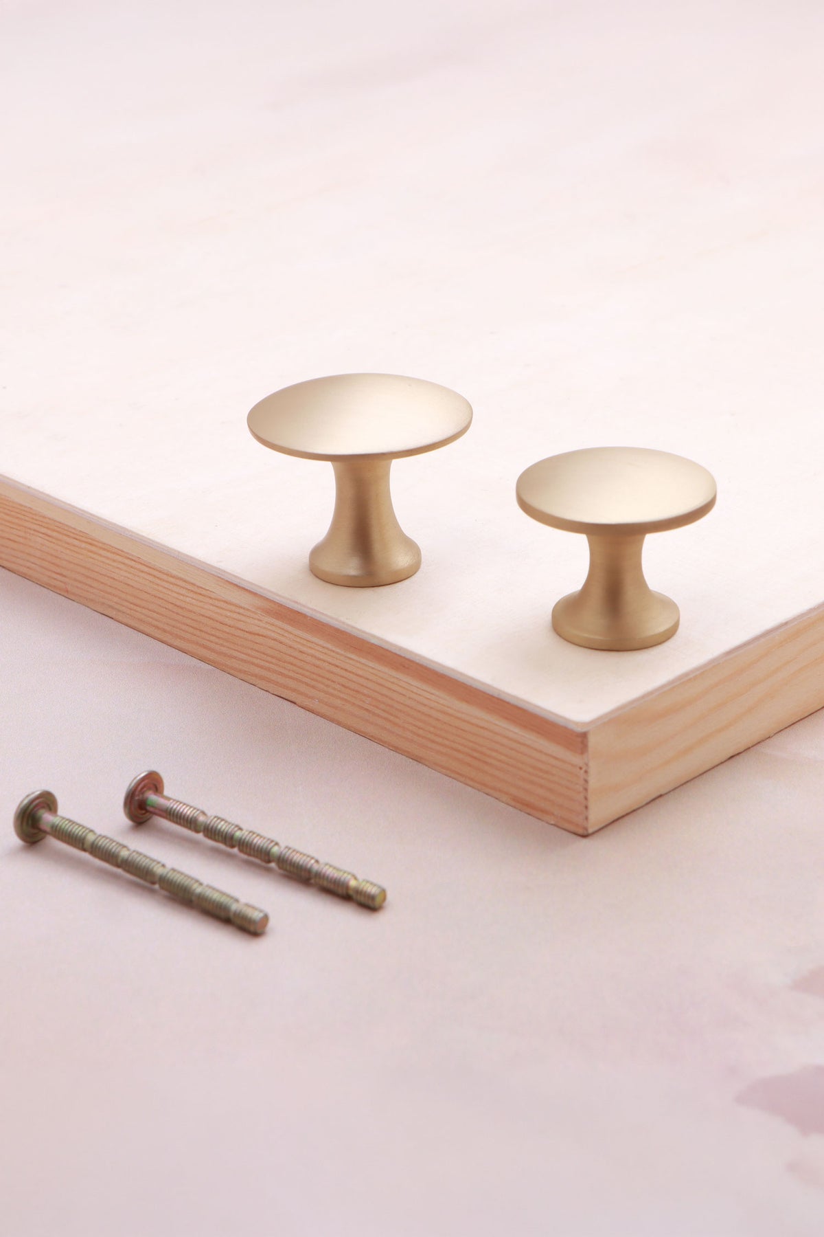 Flat top cabinet knob in satin brass
