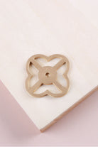 Satin brass pierced backplate, 38 x 38mm, an open quatrefoil: solid brass with a 4mm centre hole for the knob bolt