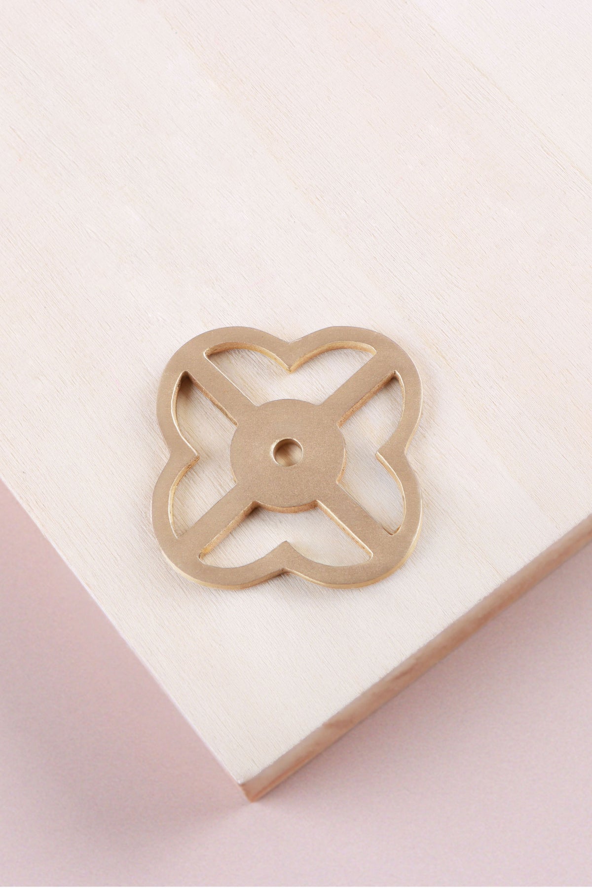 Satin brass pierced backplate, 38 x 38mm, an open quatrefoil: solid brass with a 4mm centre hole for the knob bolt