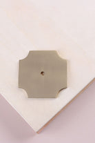 Satin brass square backplate, 50 x 50mm with scooped corners: solid brass with a 4mm centre hole for the knob bolt