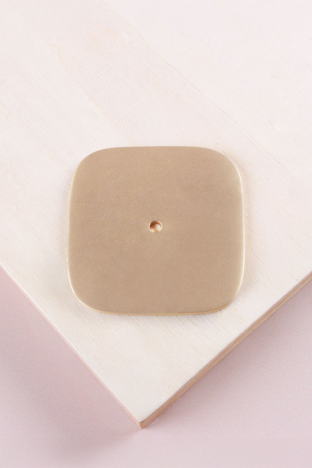 Satin brass squircle backplate, 60 x 60mm with softly rounded sides: solid brass with a 4mm centre hole for the knob bolt